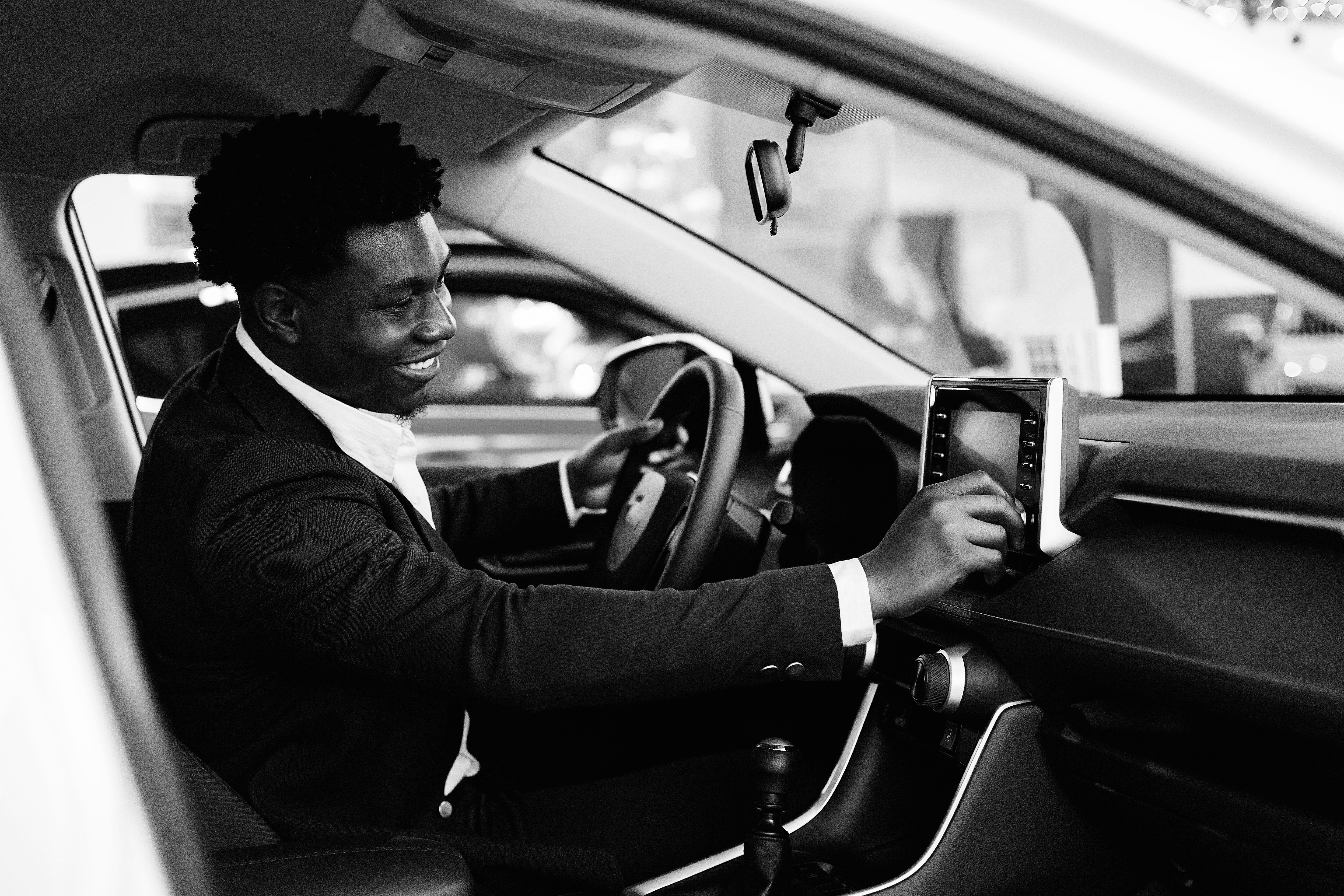 handsome-elegant-man-car-salon
